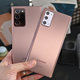 The Note 20 Ultra is on the left, with the regular Note 20 on the right, The easiest way to tell them apart is by looking at their rear cameras, as the standard Note 20 lacks Samsung’s laser autofocus system.